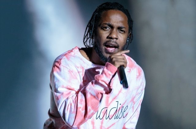 A picture of Kendrick Lamar rapping.